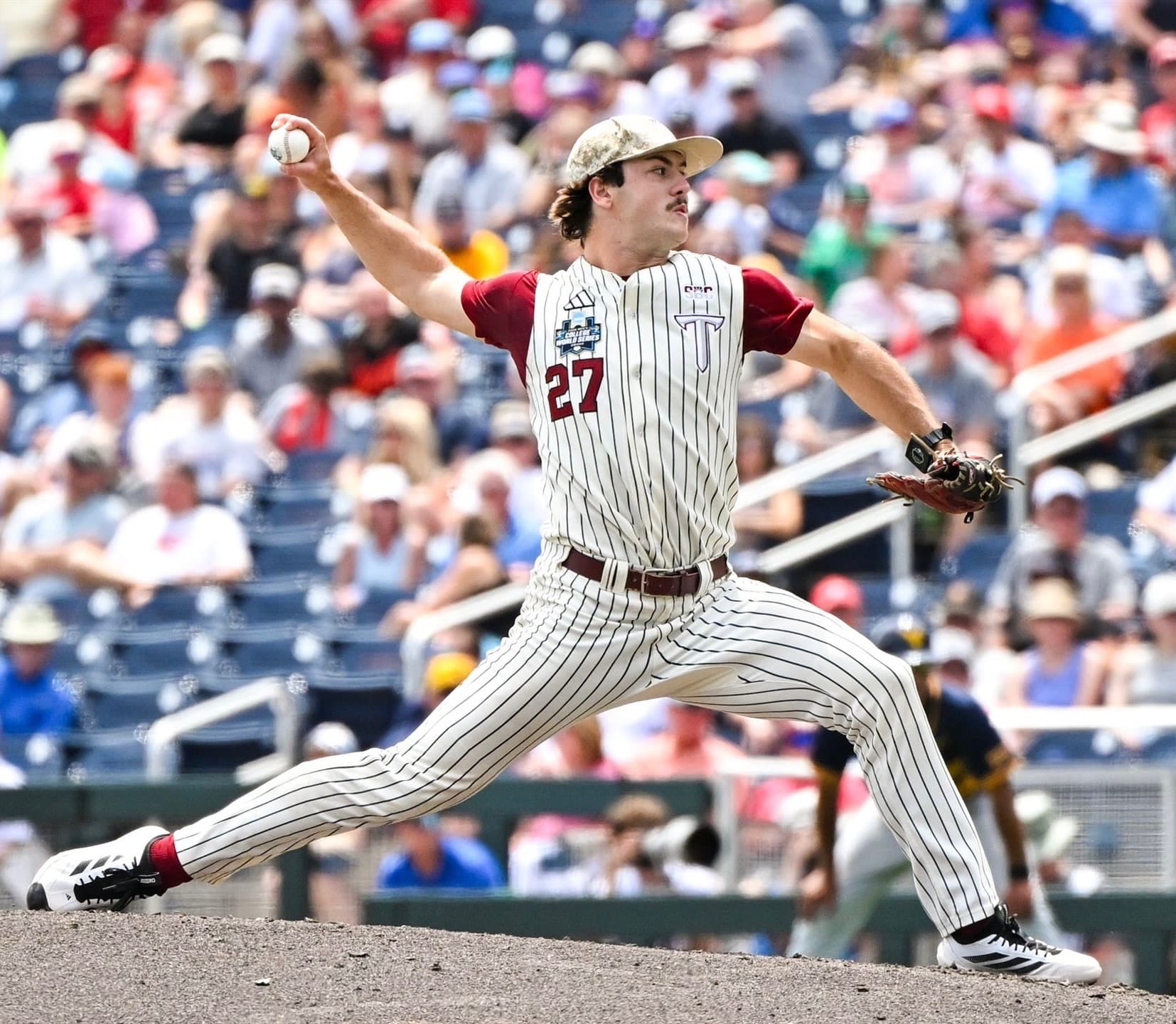 Dylan Alonso mid-delivery at the College World Series